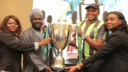 (l-r): Olabisi Joseph, ‎Secretary, Nigerian School Sports Federation (NSSF); Mallam Ibrahim Muhammad, President, Nigerian School Sports Federation (NSSF); receiving the Champions Trophy from the Director, Brand and Experience, Elvis Ogiemwanye and Head, Events and Sponsorship, Modupe Thani, both of Etisalat Nigeria during the Press Conference/Match Fixtures Draws for Etisalat School U-15 Cup National Finals held in Lagos on Monday.‎